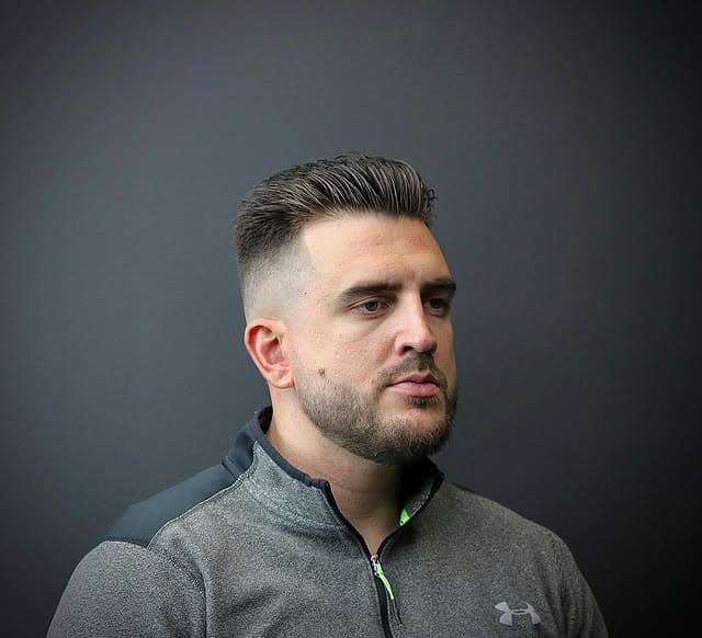 Slick-back fade with stubble