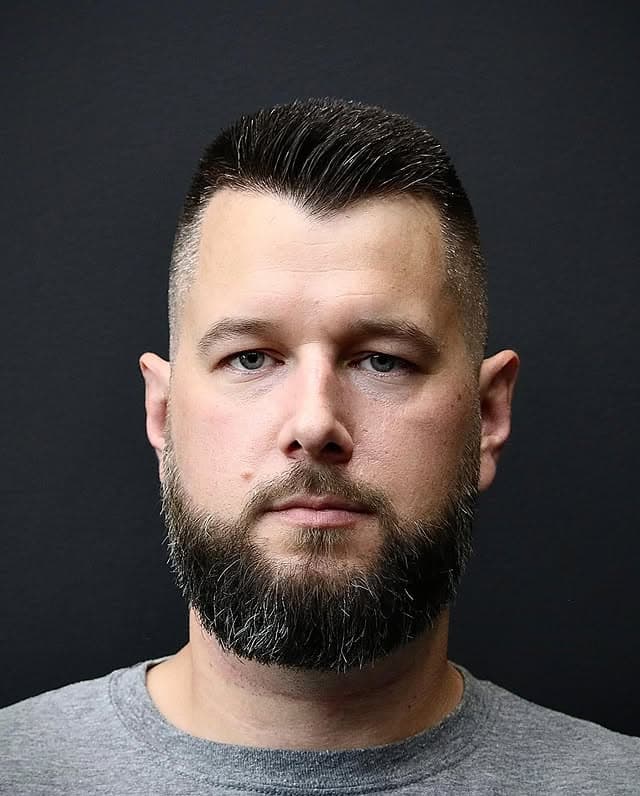 Textured pompadour fade with full beard