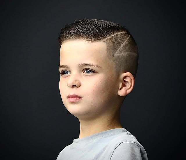 Kid's fade with a shaved hair design